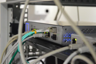 A vibrant display of various IT networking devices like routers and switches on a bright background