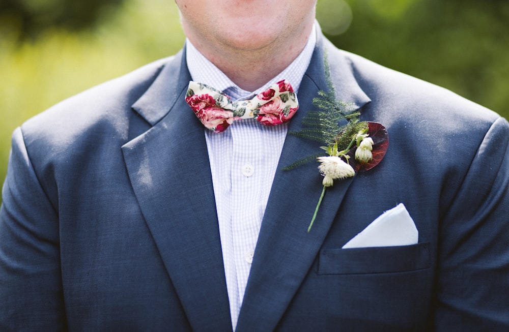 man wearing blue notched lapel suit jacket