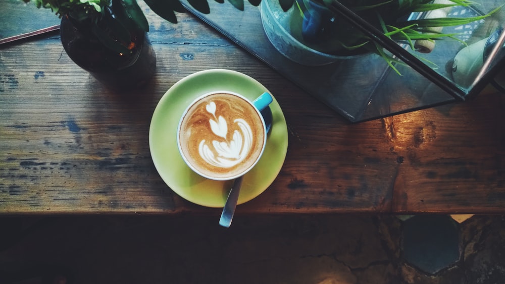 lathe art on green ceramic saucer