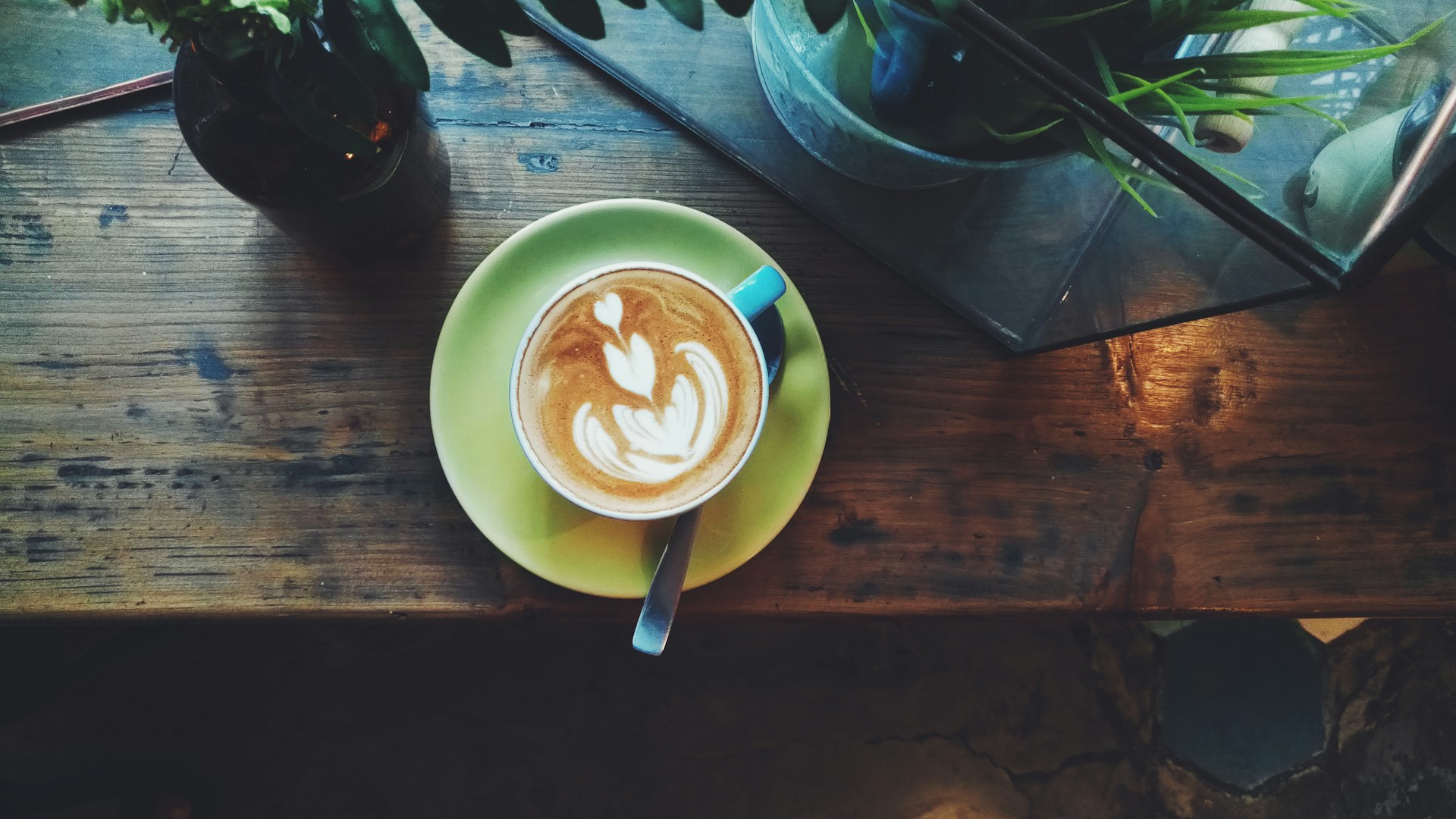lathe art on green ceramic saucer