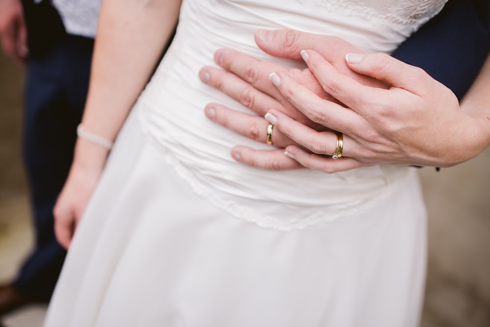 man embracing woman waist