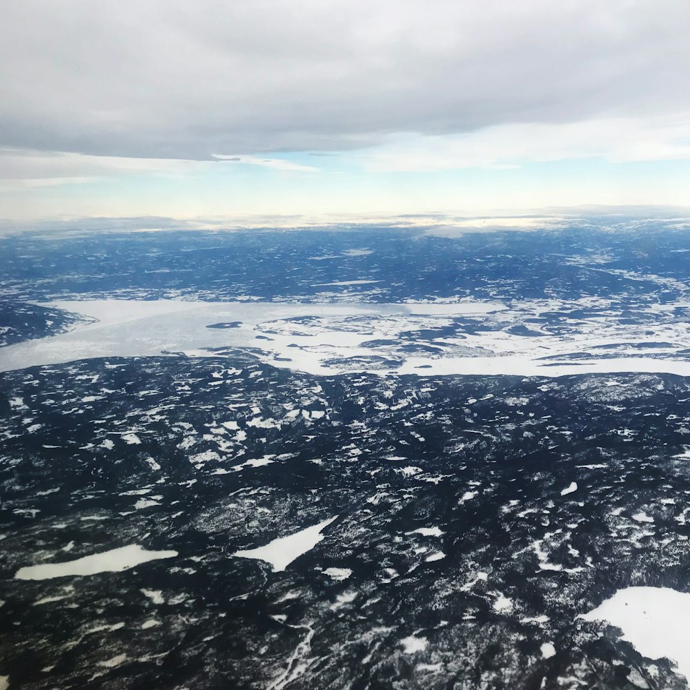 aerial view of snow covered mountains during daytime