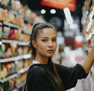 woman selecting packed food on gondola