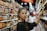 woman selecting packed food on gondola