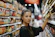 woman shopping in grocery store aisle