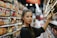 woman selecting packed food on gondola