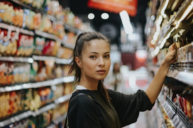 backgrounds for photo composition,how to photograph woman selecting packed food on gondola