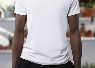 man wearing white crew-neck t-shirts