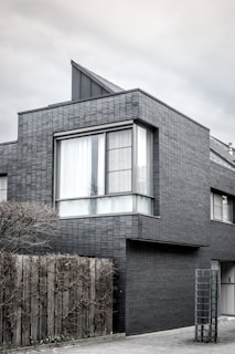grayscale photography of 2-storey house