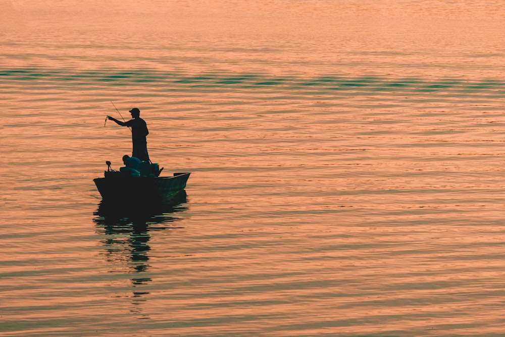 person on boat fishing