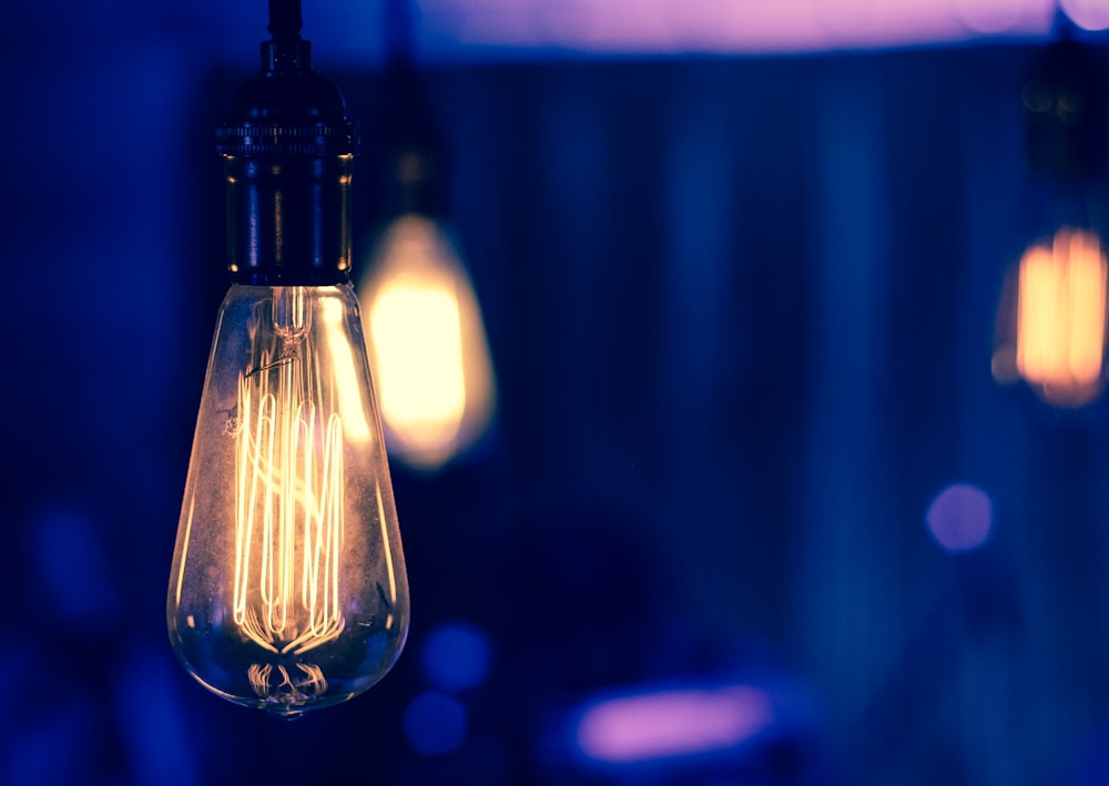 selective focus photography of light bulb