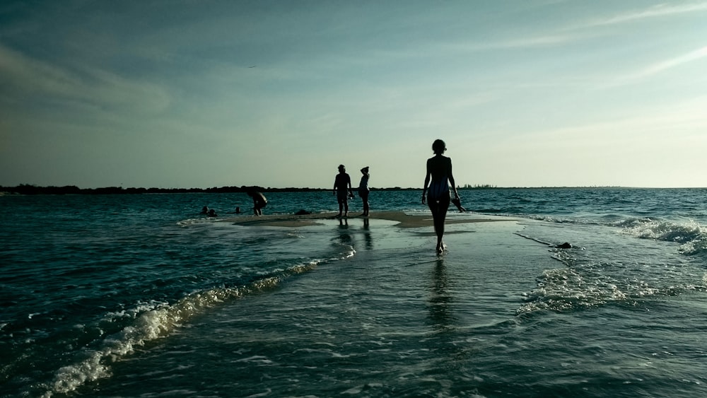 person walking on body of water during daytime