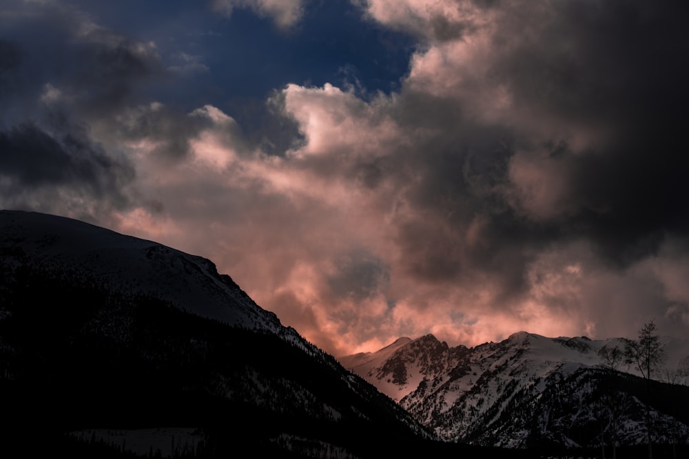 silhouette of mountain under white sky