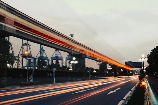 time-lapsed photo of pave road during nighttime in HarbourFront Singapore