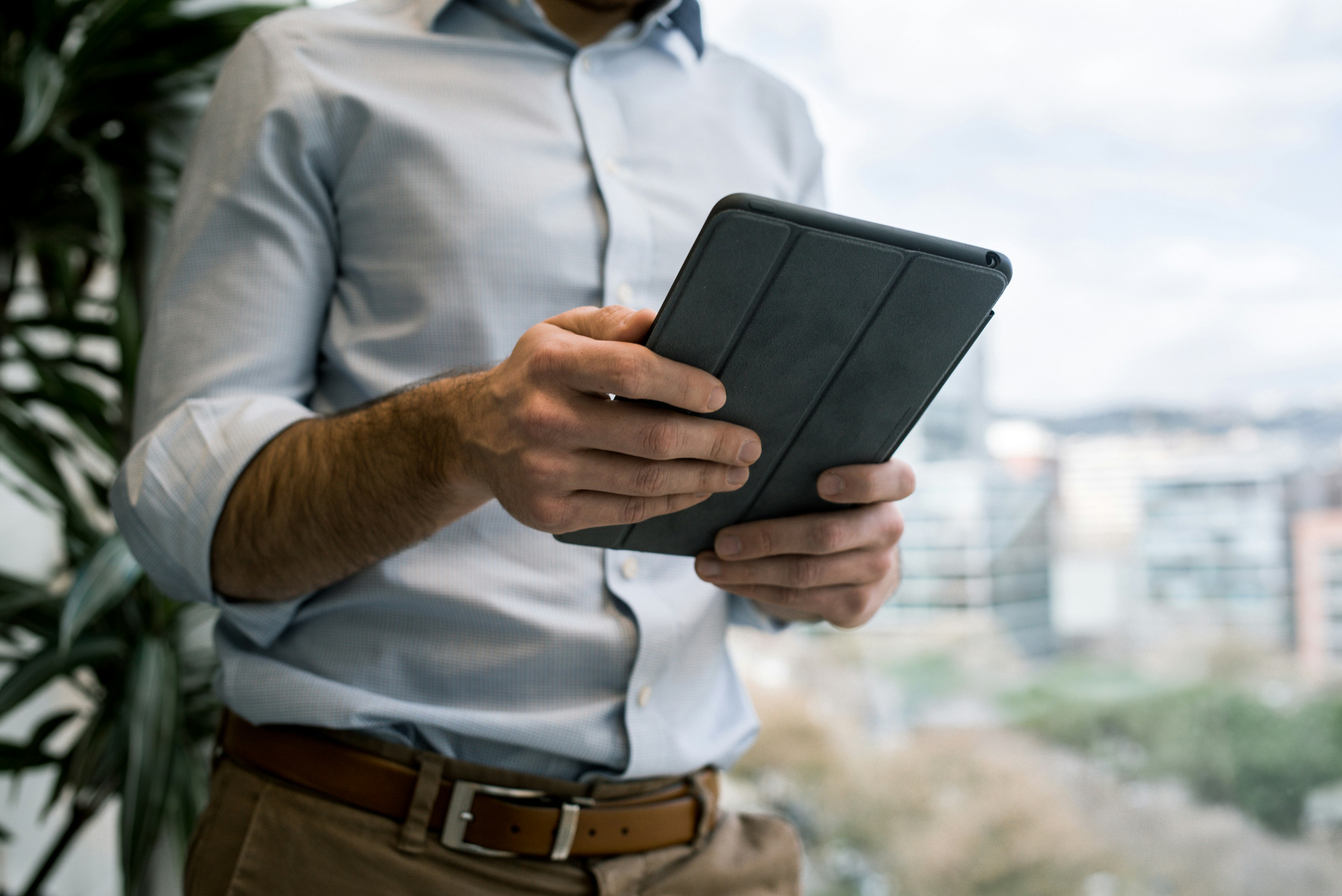 venture capital investor reviewing financial reports on tablet computer