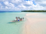 people riding on boat during daytime