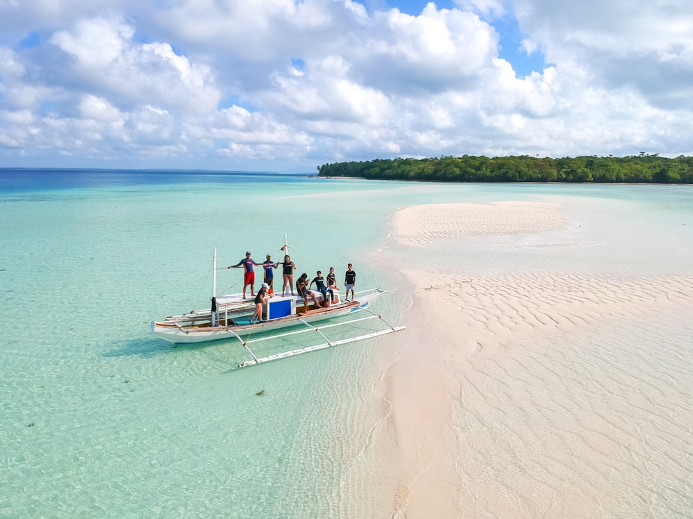 people riding on boat during daytime