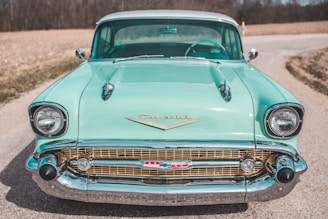 vintage green car on road