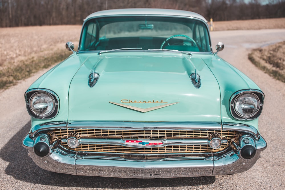 vintage green car on road