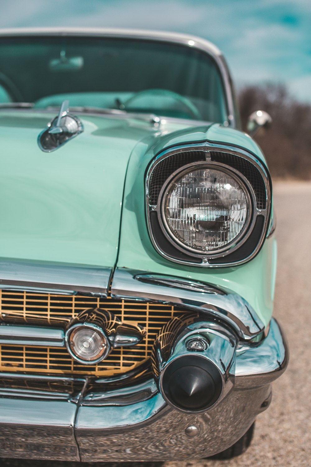 close-up photography of classic teal car