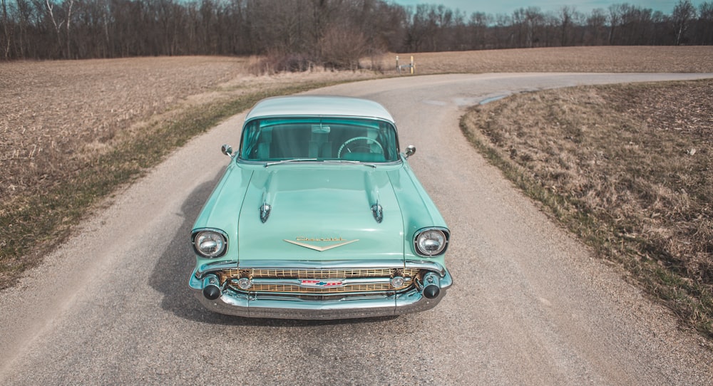 green car on road