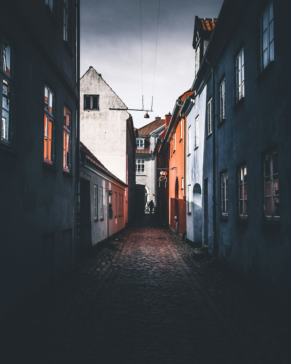 person on alleyway during nighttime