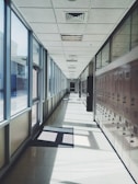 A school hallway with freshly cleaned floors and bright lighting.