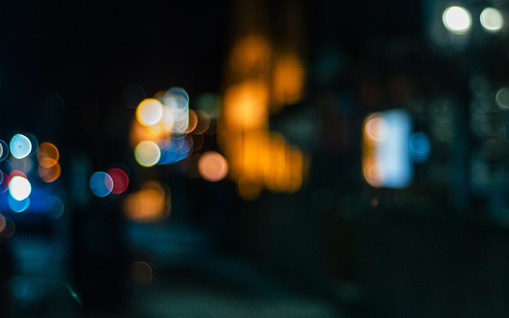 a blurry photo of a city street at night