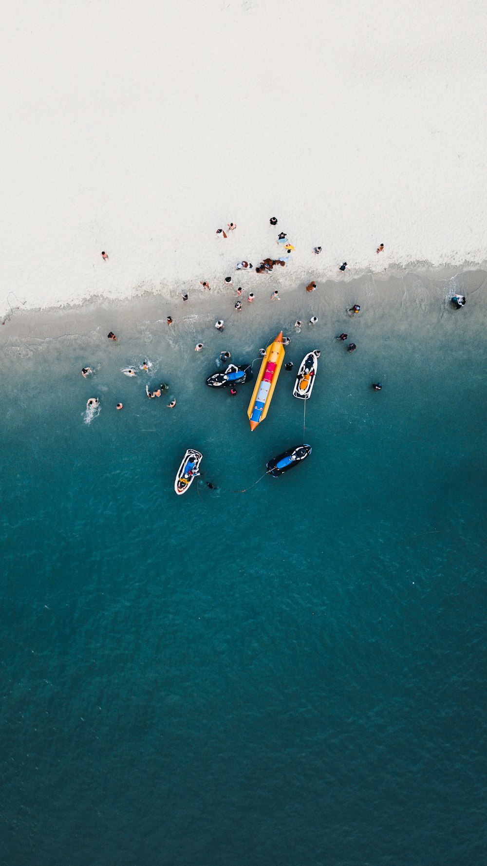 aerial photography of boats on seashore