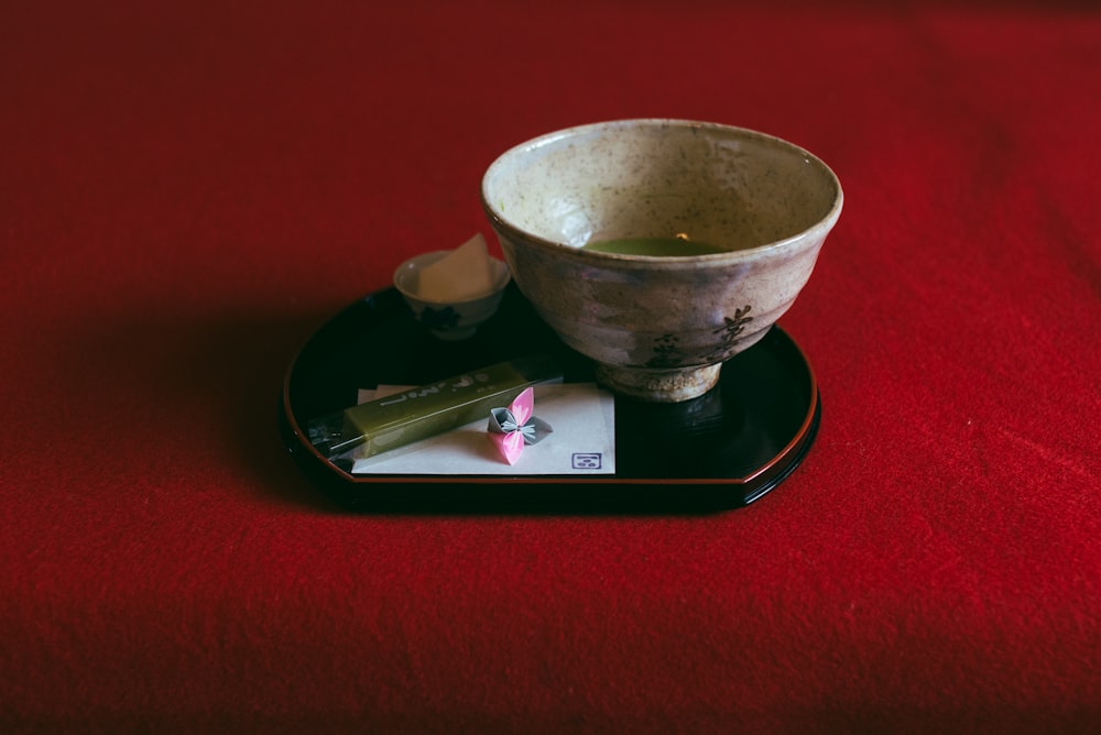 beige bowl beside green thumb drive