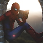 Spider-Man leaning on concrete brick while reading book