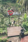 woman on swing photo during daytime