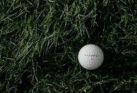 white Maxfu 2 golf ball on green grass