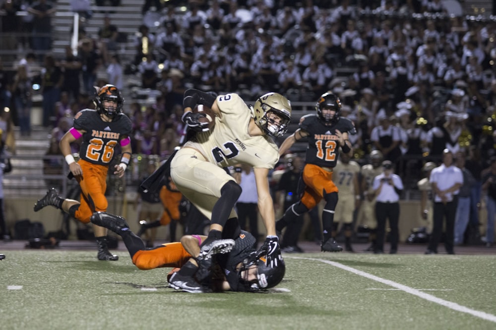 football player tackling another player in a match