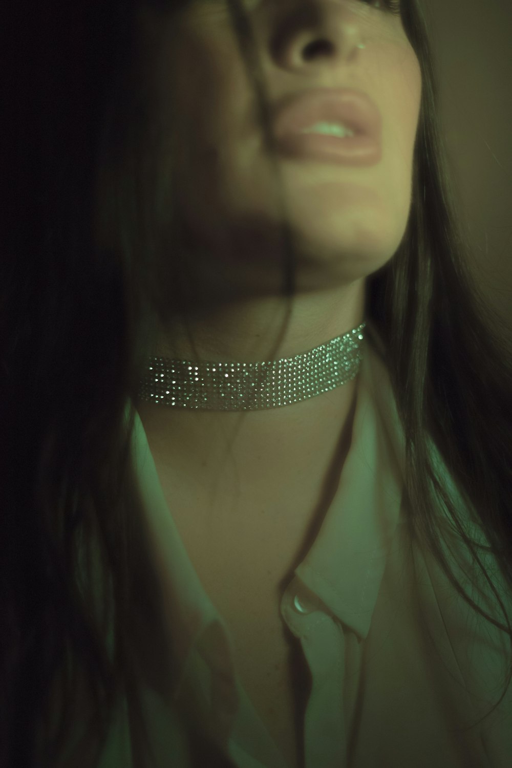 woman wearing gray choker necklace