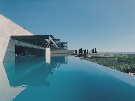 wide angle photo of brown and blue building in Los Cabos Mexico