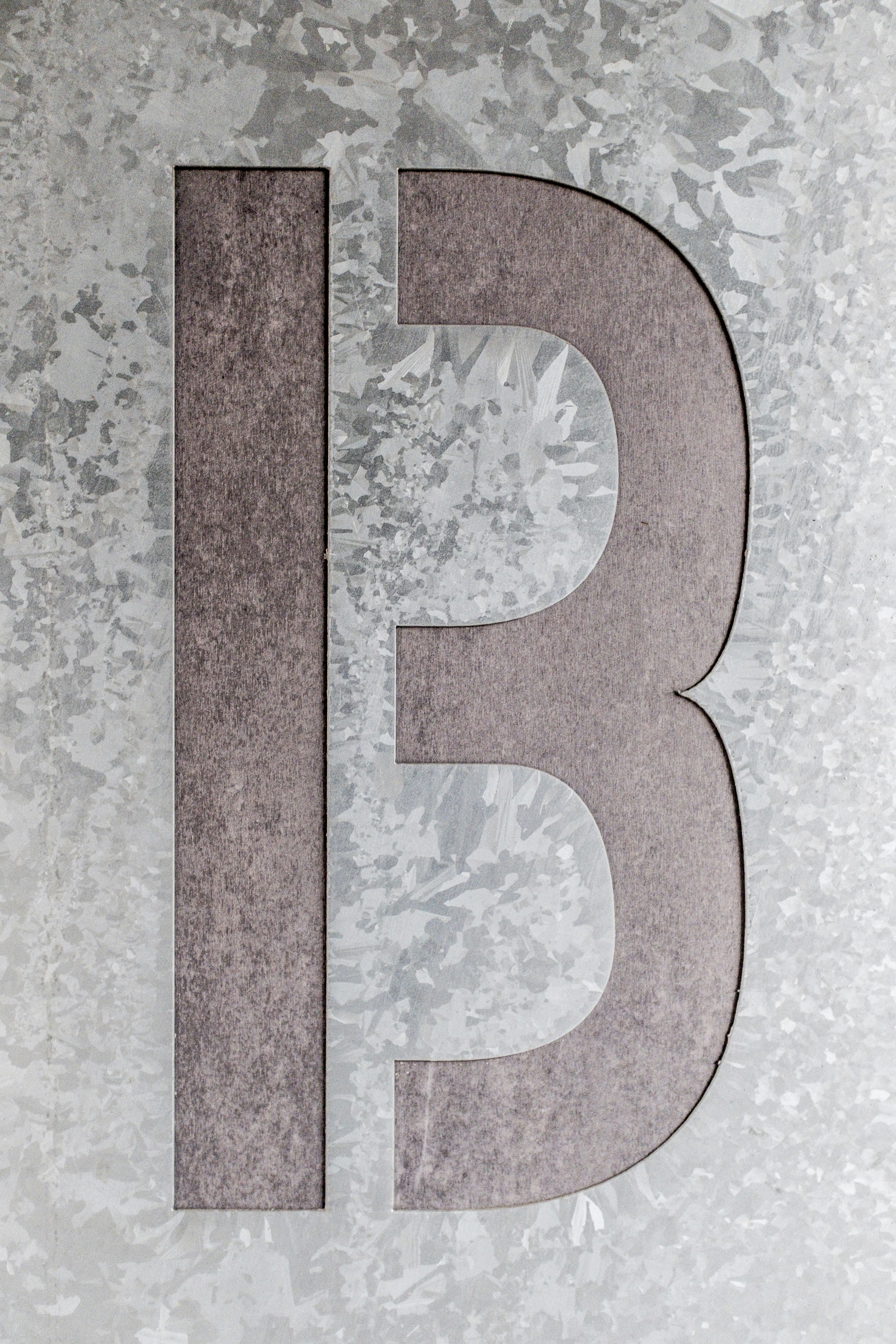 brown and grey letter B artwork