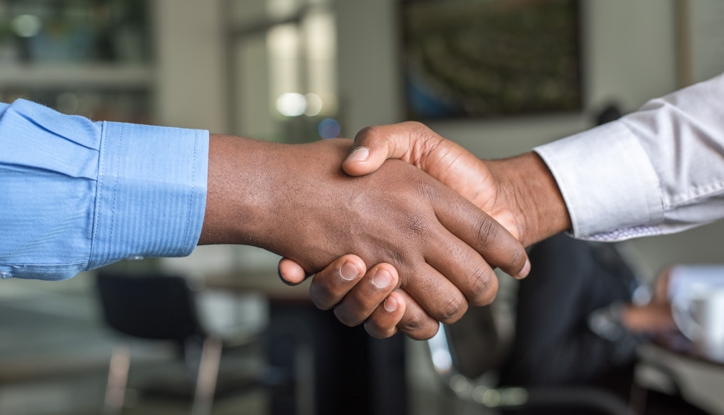 two people shaking hands