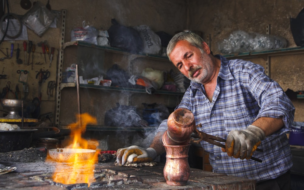 man holding brown hand tool