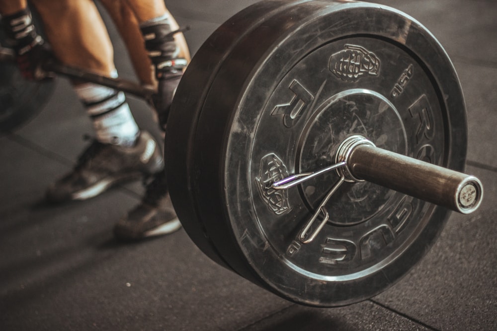 person holding barbell