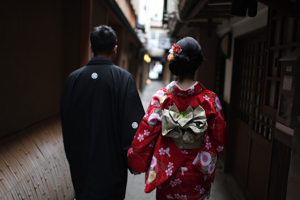 man and woman walking on hallway