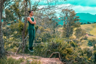 A serene landscape featuring a model wearing sustainable clothing in nature.