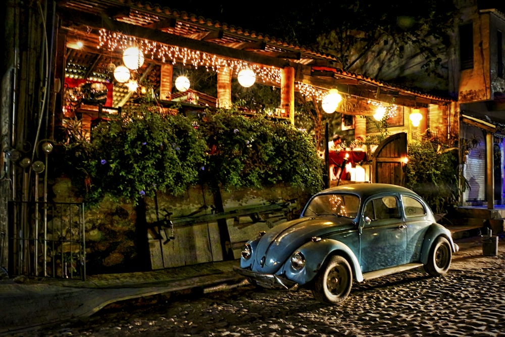 high-saturated photography of parked blue Volkswagen Beetle