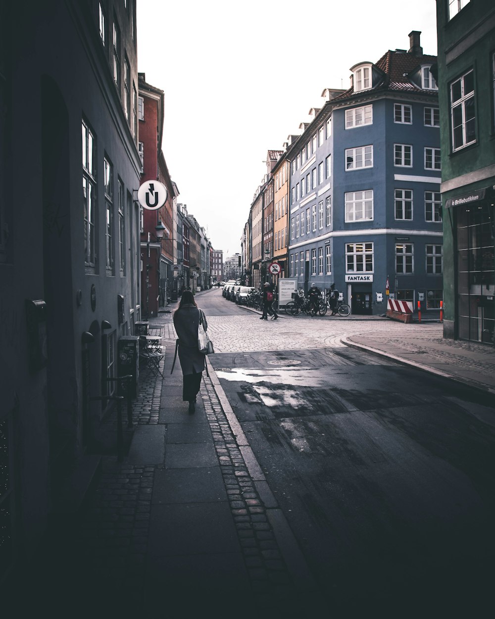 woman walking on road during daytime