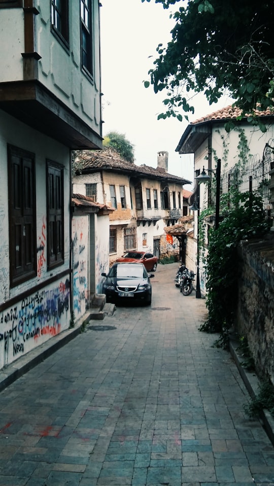 street photography of parked black car at village in Antalya Turkey