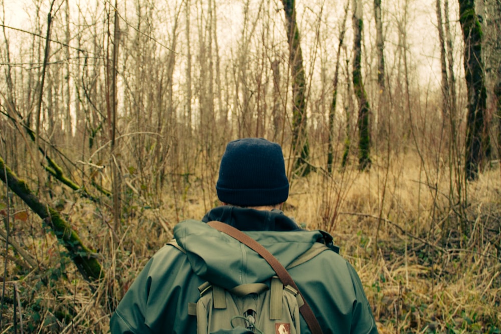 man walking on forest