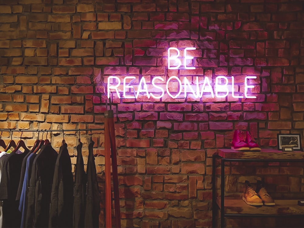 Be Reasonable neon signage