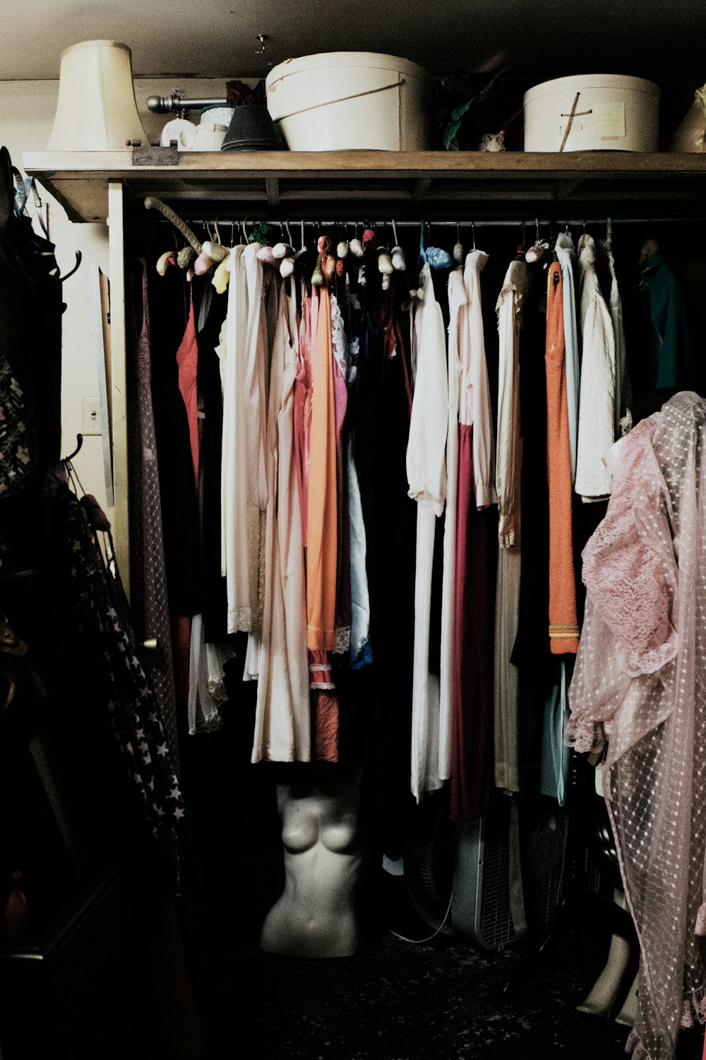 clothes hanged inside wardrobe