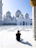 A joyful traveler capturing the moment in front of the Masjid al-Nabawi.