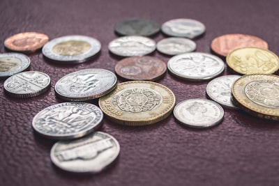 round gold-colored and silver-colored coin lot coins zoom background